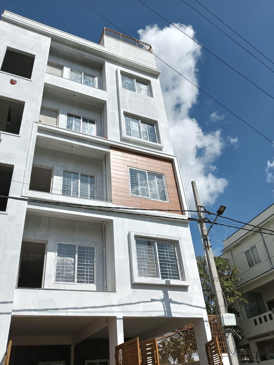 Modern Multi-Floor Residential Building with Designer Woodgrain Accents