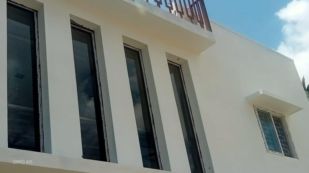 Contemporary Architectural White Villa with Tall Vertical Windows