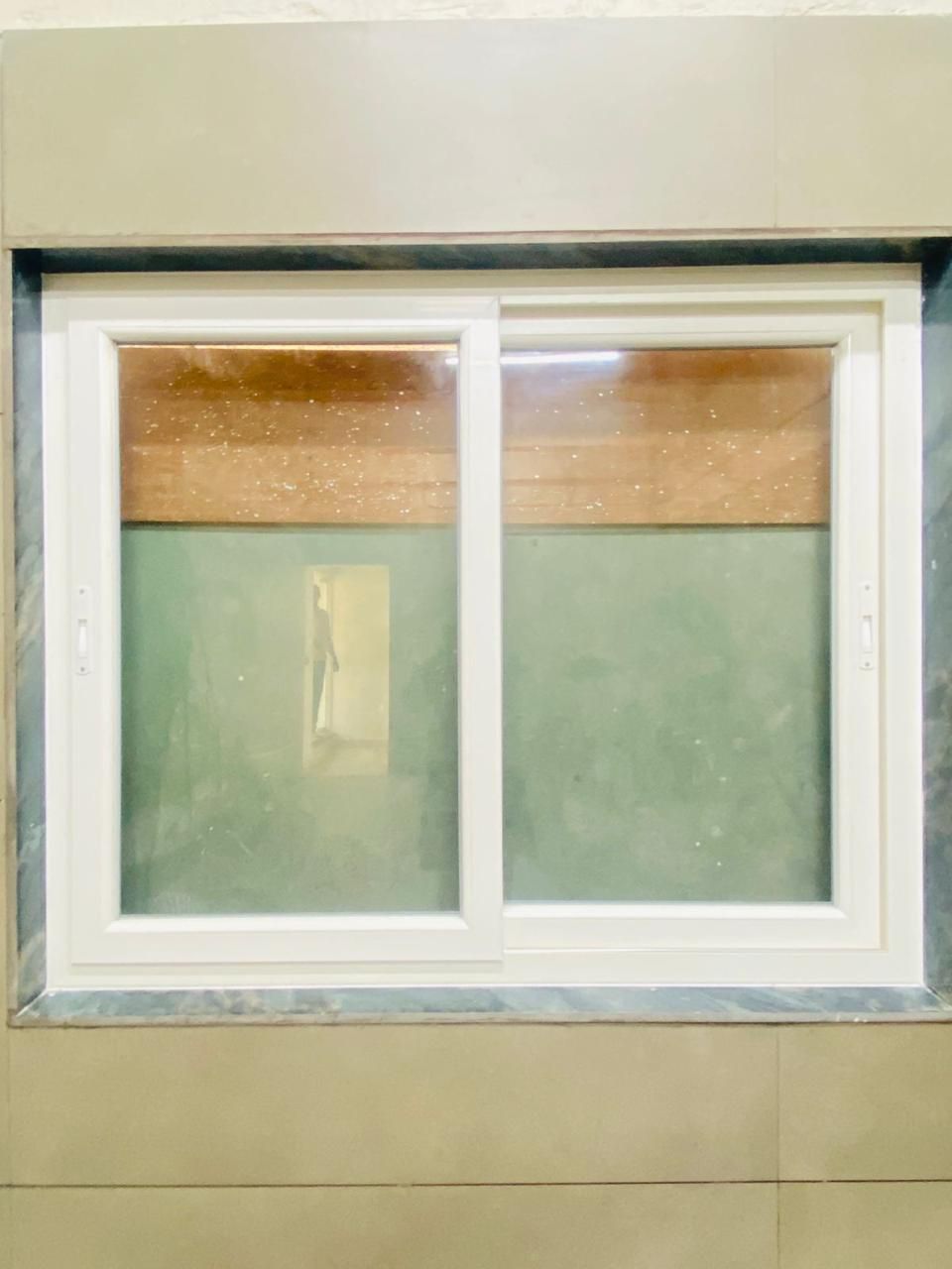 Interior Installation of Smooth Two-Track Sliding Window with Granite Sill