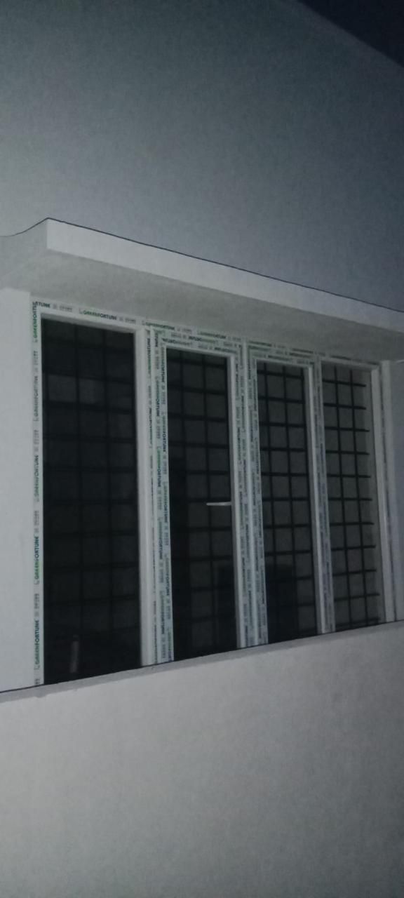 Four-Track White uPVC Sliding Window with Integrated Safety Grills