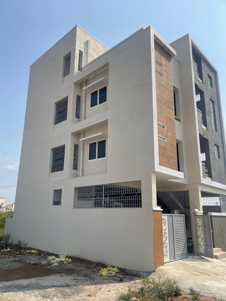 Four-Storey Building with Vertical Timber Finish Accents and uPVC Windows