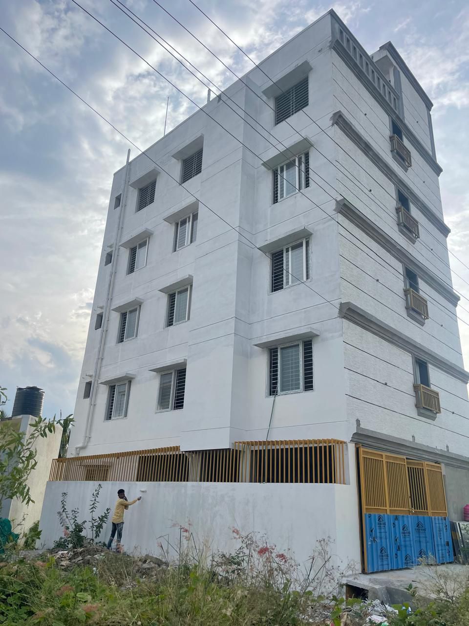 Five-Storey White Residential Building Featuring Uniform uPVC Sliding Windows