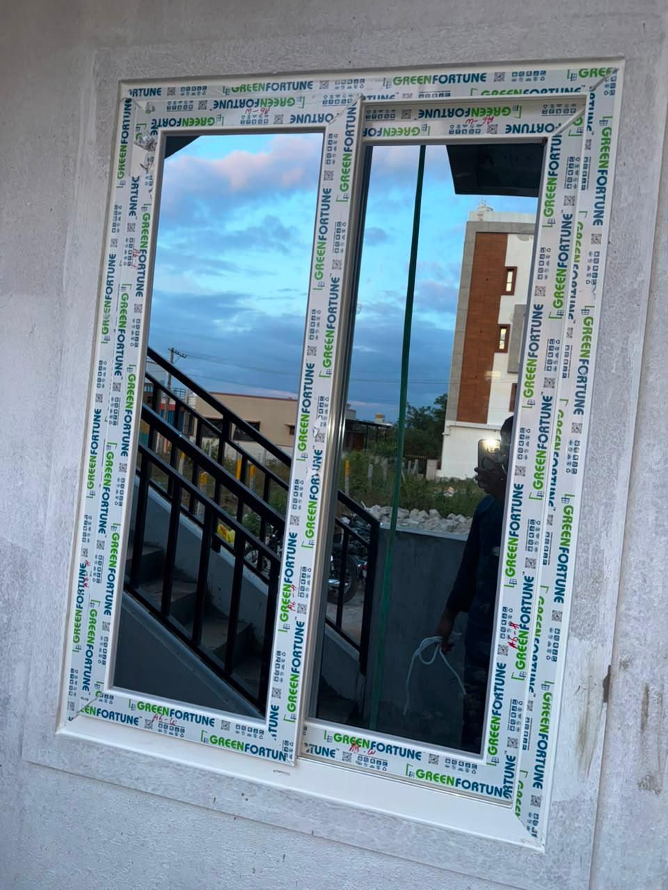 Upper Floor Terrace uPVC Casement Window with Evening Sky and Rooftop View