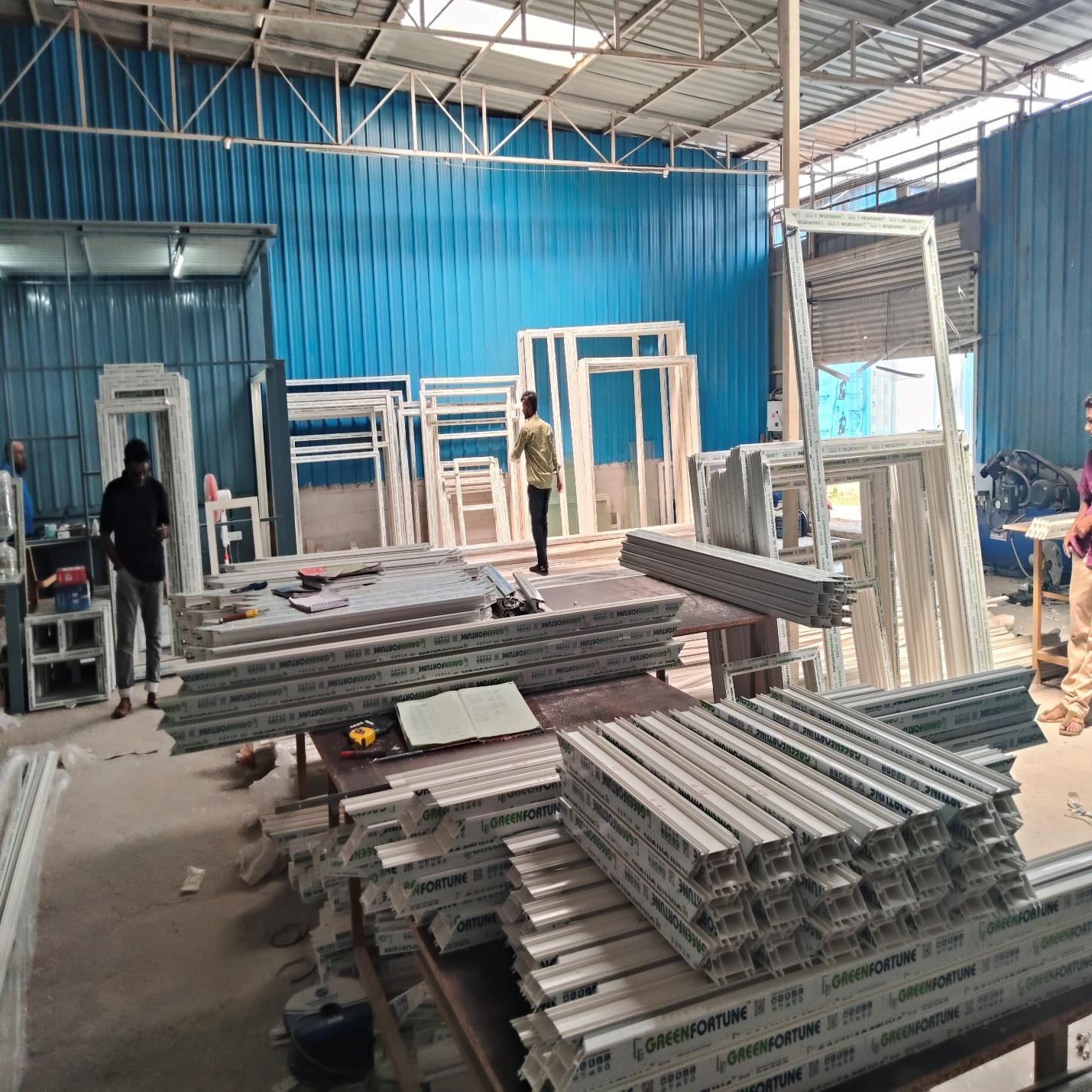 Technicians Assembling Multi-Chamber Greenfortune uPVC Profiles